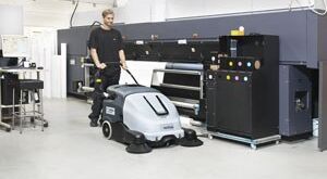 Walk behind sweeper designed to increase productivity