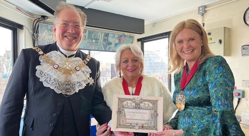 Lorraine raises Tower Bridge, accompanied by the Lord Mayor.